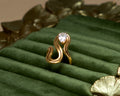 Elegant Gold Swirl Ring with Pear-Cut Stone